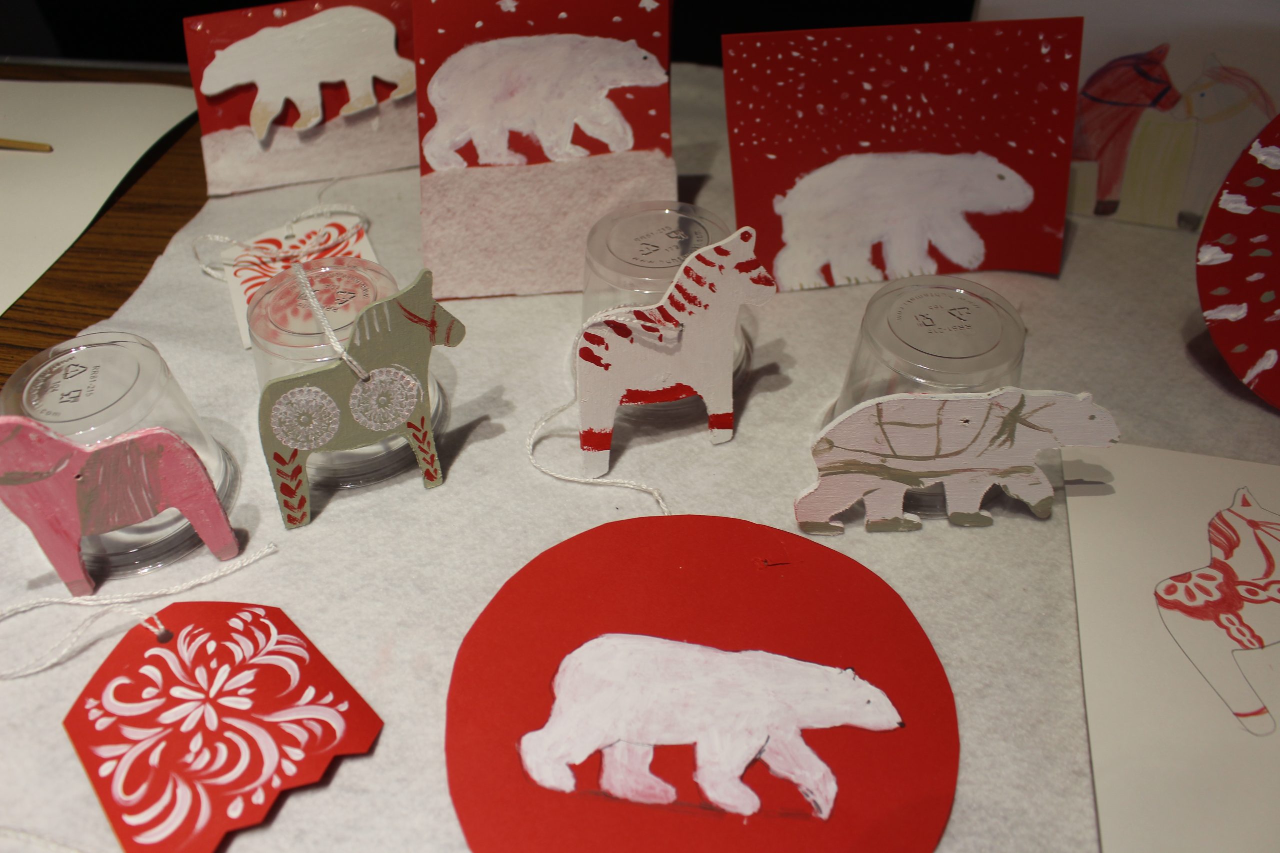 A selection of children's crafts including red and white polar bears.