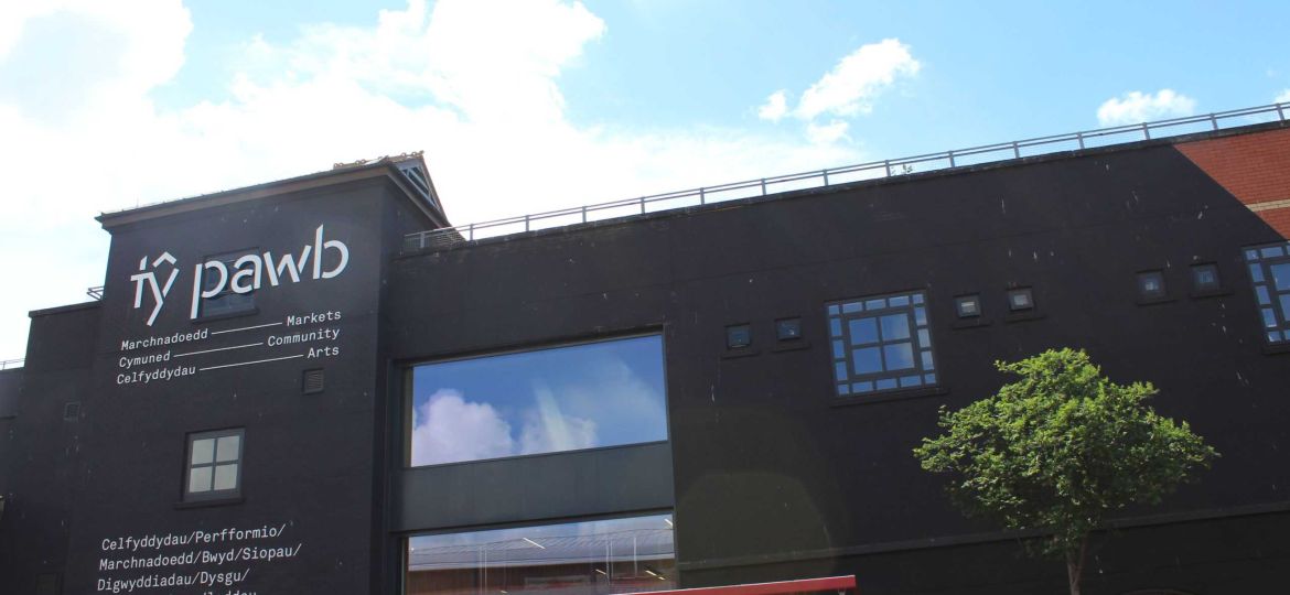 The outside of our building on a sunny day. 