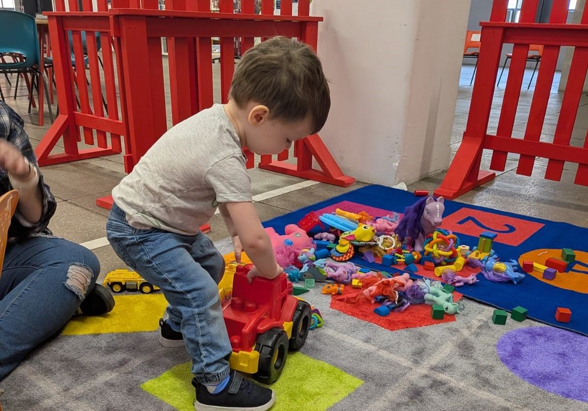 Toddler A preschool aged child plays in the Mombies play area.