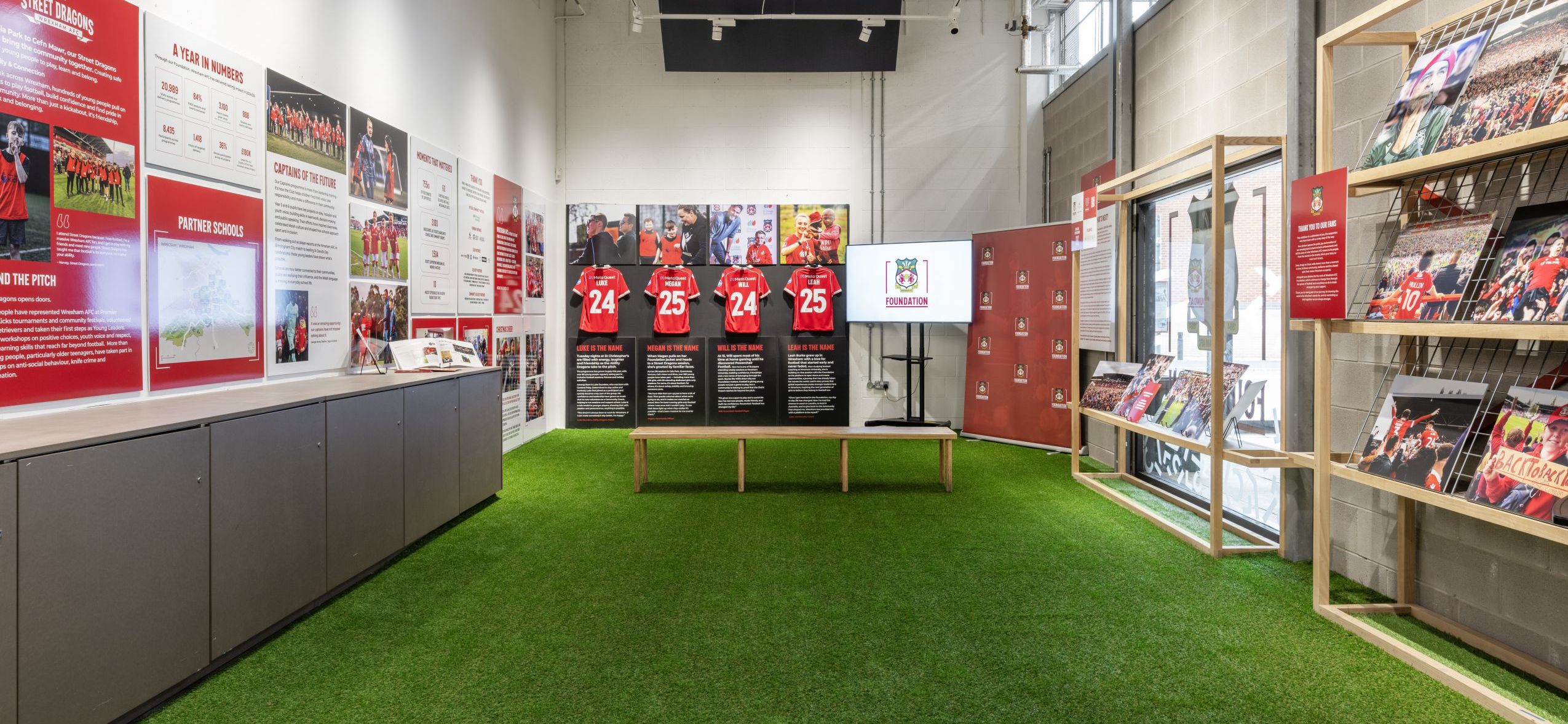 Wide shot showing the Wrexham AFC Foundation exhibtiion in Oriel Bach gallery space